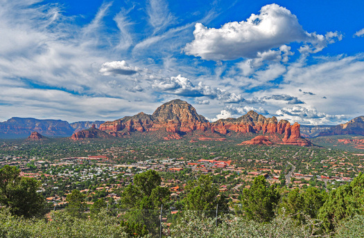 City with Red Rock Formations Behind It