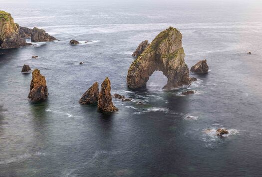 Large rocks protruding fro water